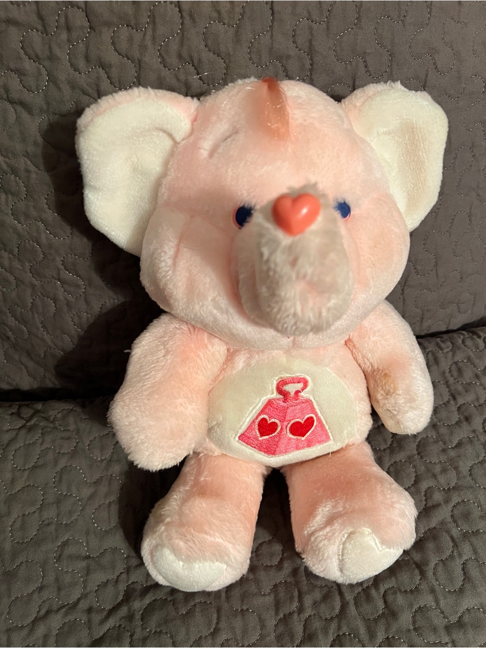 Vintage 1984 Kenner Lotsa Heart Elephant plush from the Care Bears Cousins line.